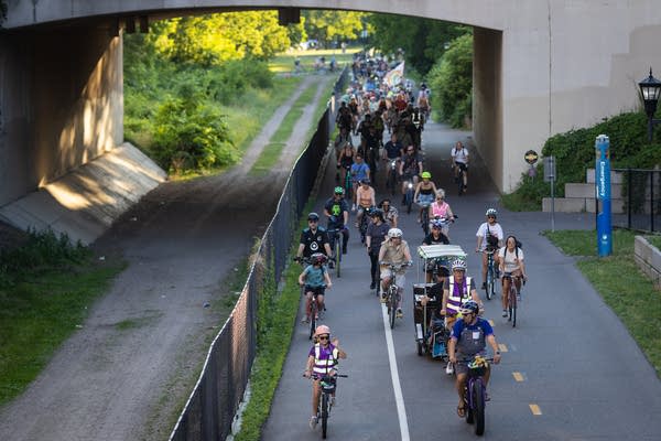 People ride on a bike path
