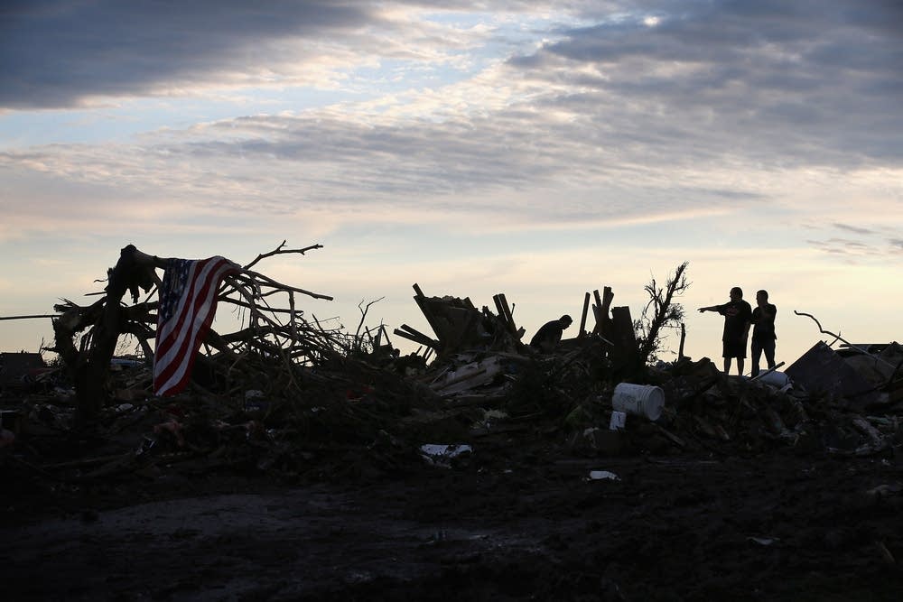 Residents search through rubble