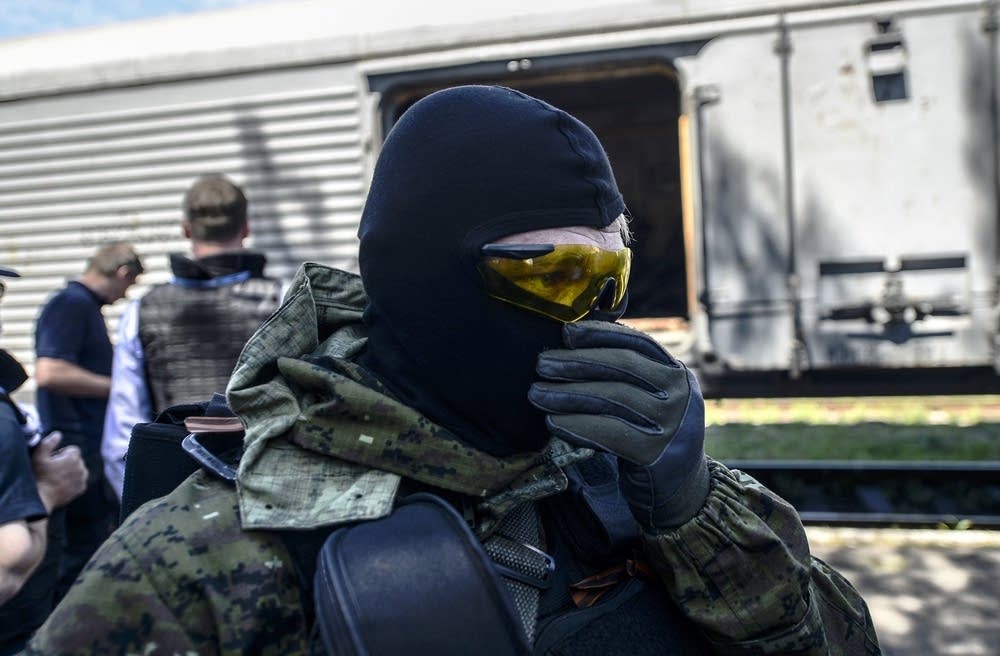 Inspecting a train carrying remains of victims