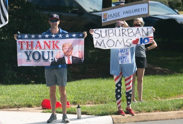 People holding signs and banners. 