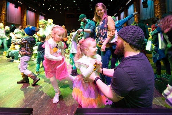 Children and adults dancing 