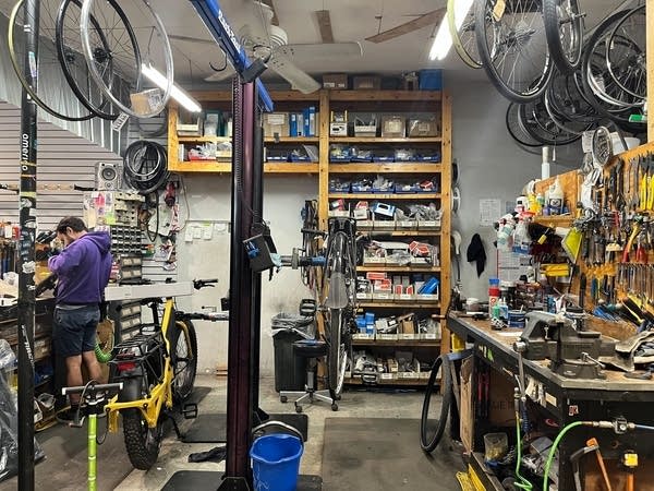 A workbench with supplies and tools to fix bicycles.