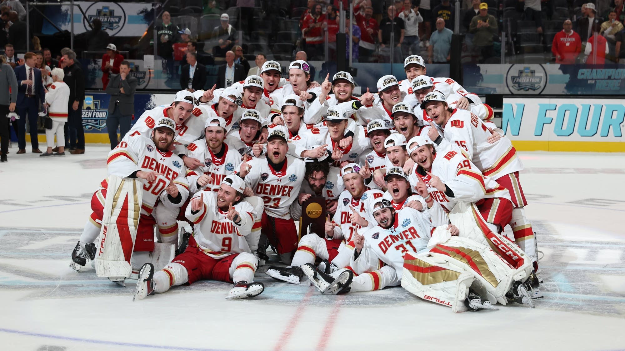 Denver beat Wisconsin 2-1 for 11th national title