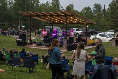 the band the honeydogs performing on an outdoor stage
