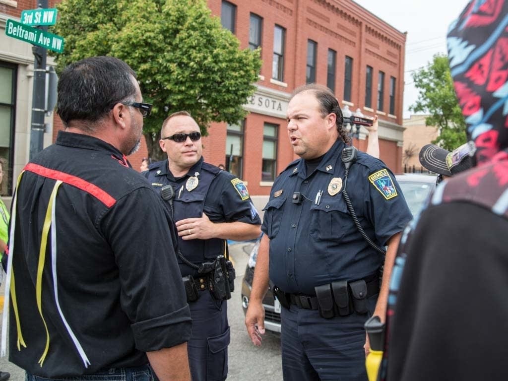 Marty Cobenais talks to police.