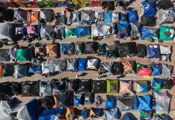 An aerial view of a migrants camp where asylum seekers wait for US authorities to allow them to start their migration process outside El Chaparral crossing port in Tijuana, Baja California state, Mexico on March 17, 2021. 