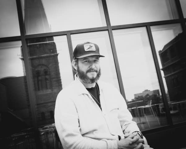 Justin vernon posing for photos