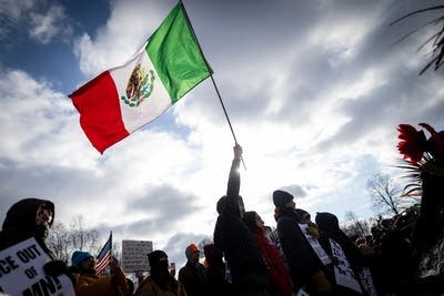 A person holds a flag