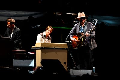A band performing on an outdoor stage