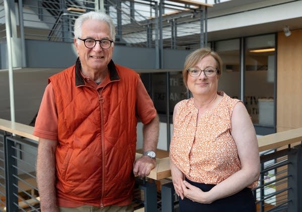 A man and woman poses for a portrait