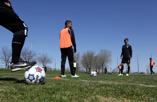 Minnesota United players listened before a drill.