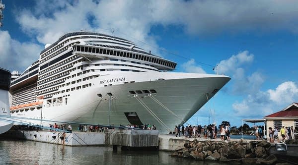 Tourists arrive from a cruise ship in St. John's, Antigua, in December. While its sister island Barbuda was nearly destroyed in Hurricane Irma, Antigua was left relatively untouched.