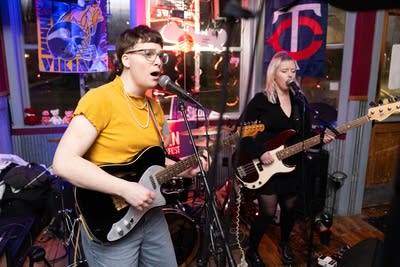 Two people performing and singing