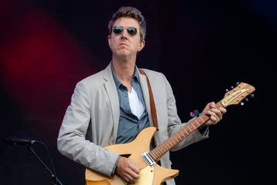 hamilton leithauser and his band performing on stage