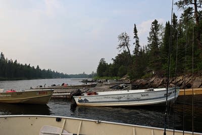 Idle boats at Voyageurs Canoe Outfitters.