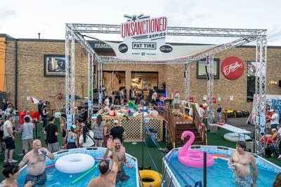 People splash, play and have fun at an outdoor pool event