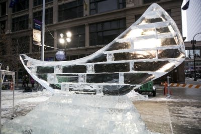 Light shines through a finished ice sculpture