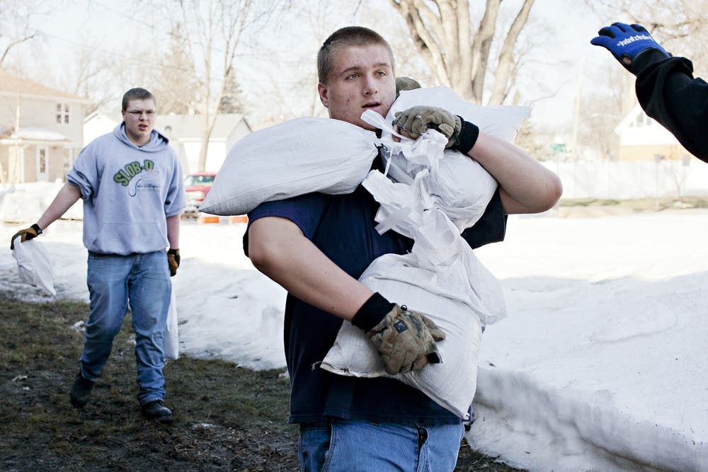 Carrying sandbags
