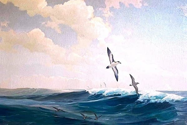 Painting of two seagulls flying just above the ocean in front of a clear blue sky.