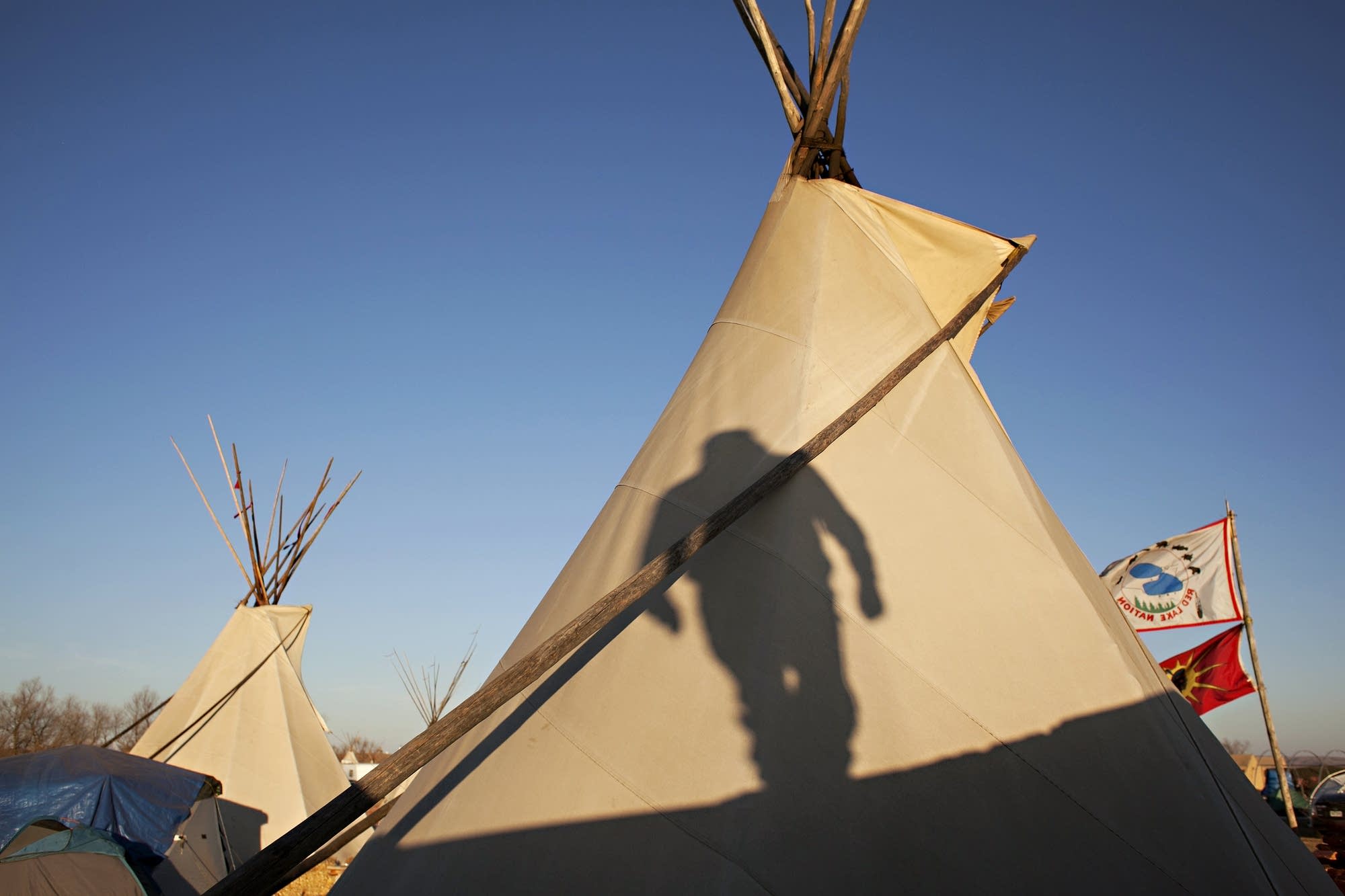 Frank Sander's shadow graces a tipi