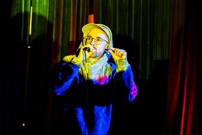 A rapper performing onstage