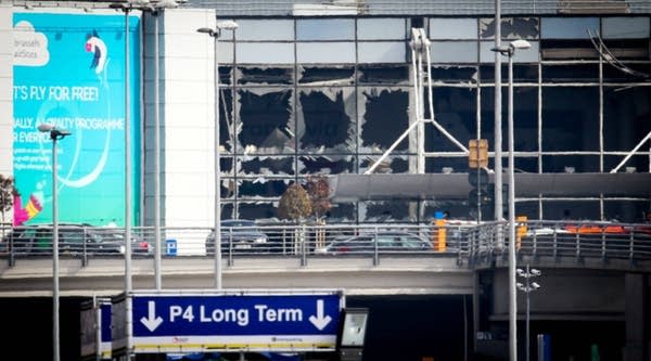 A picture shows the shattered glass facade of the departure hall at Brussels Airport in Zaventem on Tuesday following twin blasts. 