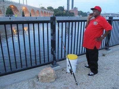 Hooking the wily river catfish on a summer evening