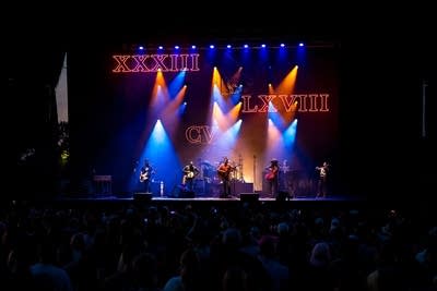 A band performing on an outdoor stage