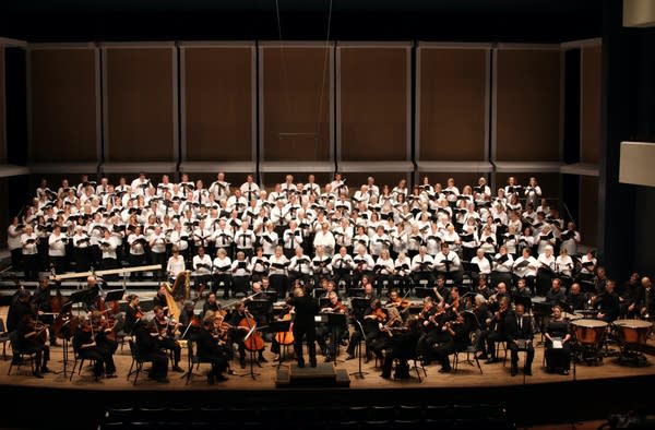 A choir and orchestra on a stage