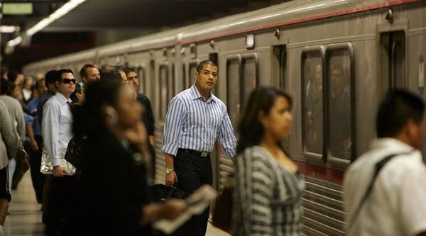 Passengers board Metro Rail subway trains during rush hour in Los Angeles, California.
