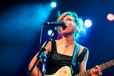 Christy Costello performing on stage