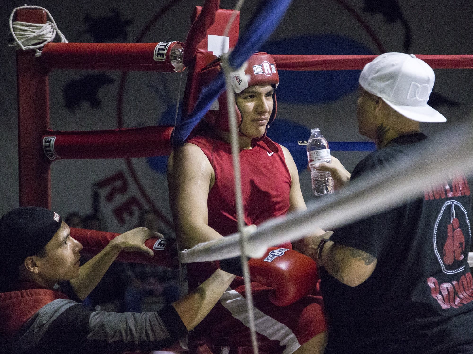 Louis Jourdain, left, and Mike Donnell, right, assist Zack Morrison.