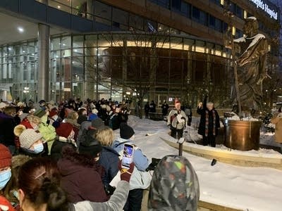 Employees%20gather%20for%20a%20vigil%20outside%20of%20St.%20Joseph's%20Hospital.