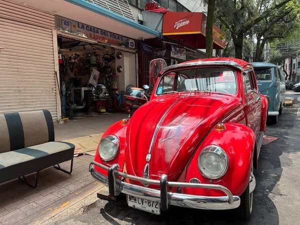 A bright red vintage VW bug in Mexico City.