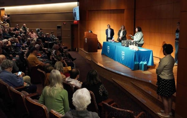 Jackie Fallon, naturalist and biologist with Mayo Clinic's peregrine falcon, leads the banding event at Mayo Clinic's Geffen Auditorium on May 22. 