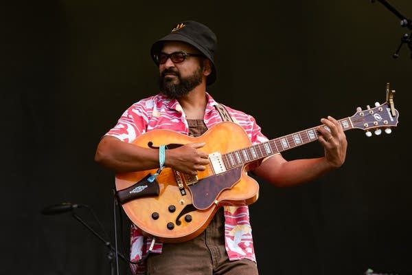 laamar and his band performing on stage