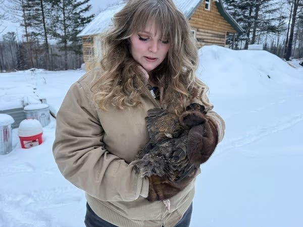 woman holding a chicken2
