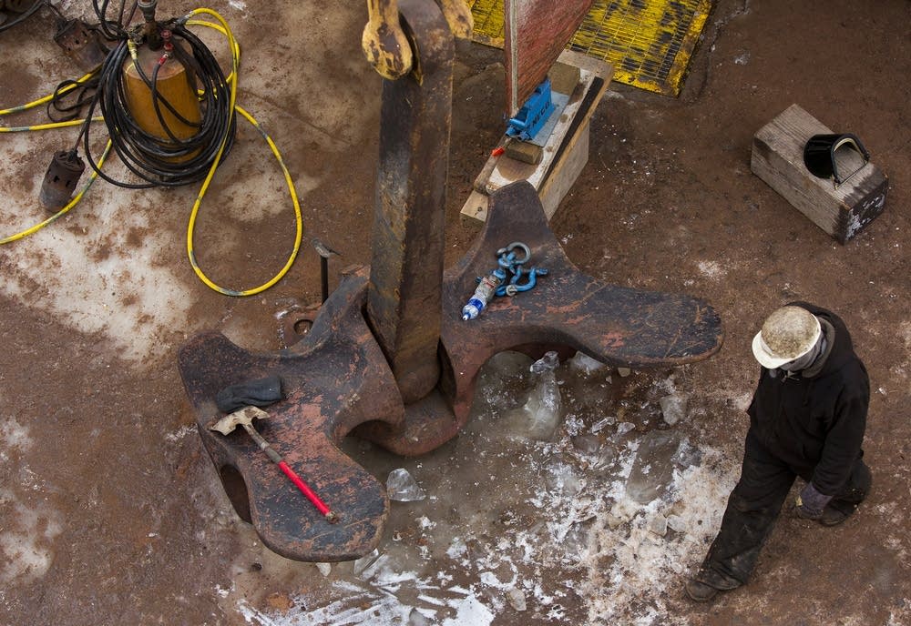 Workers perform maintenance on the Kaye E. Barker.