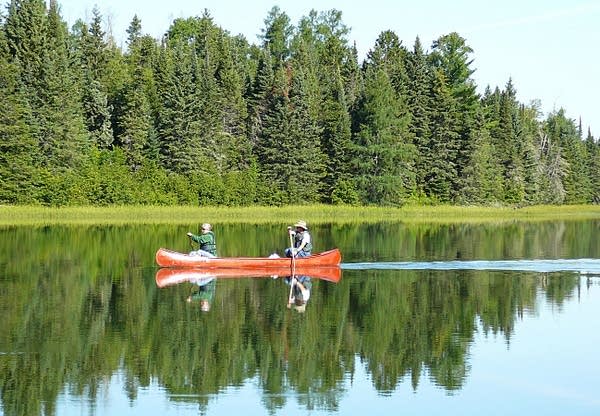 Canoeists paddle across Lake Itasca in Itasca State Park.