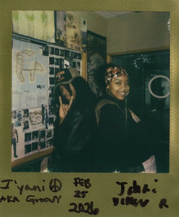 two people posing in a polaroid image