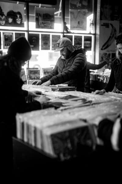 People browse records in a record store