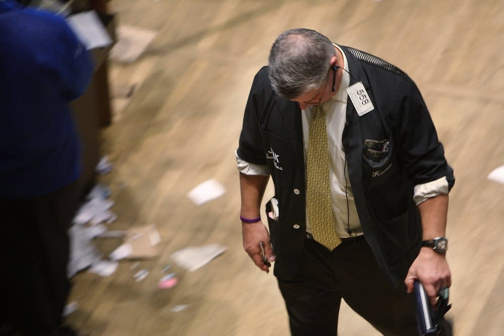 A trader works on the floor of the NYSE
