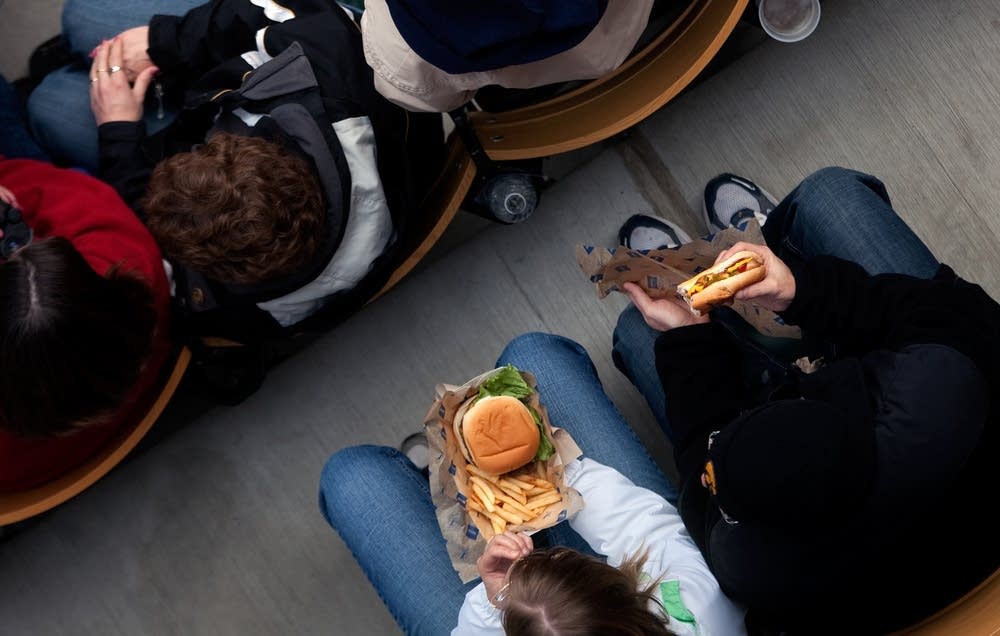 Enjoying food in their seats