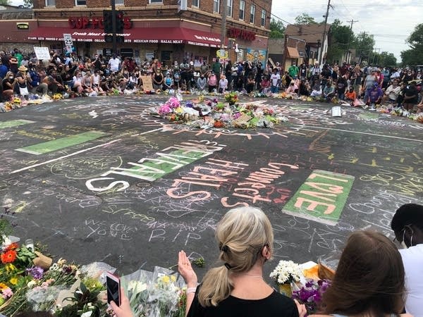 People gather at the sight of George Floyd’s death
