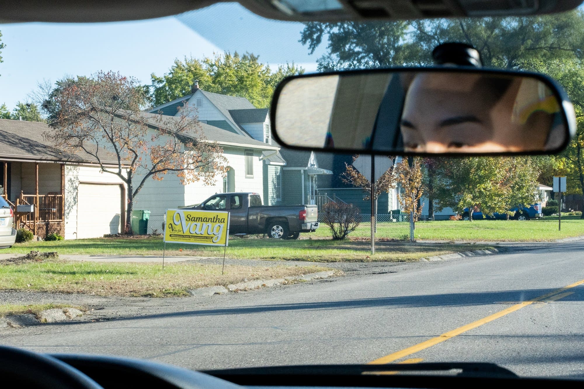 A yard sign supporting Samantha Vang stands in a Brooklyn Center yard.
