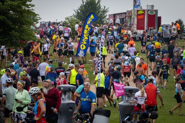 A crowd of people waits in line