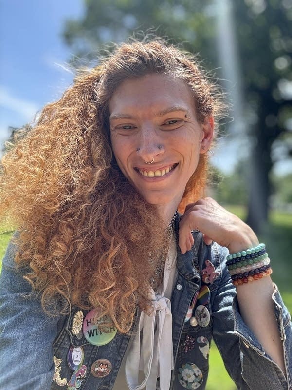 A woman smiles in a selfie