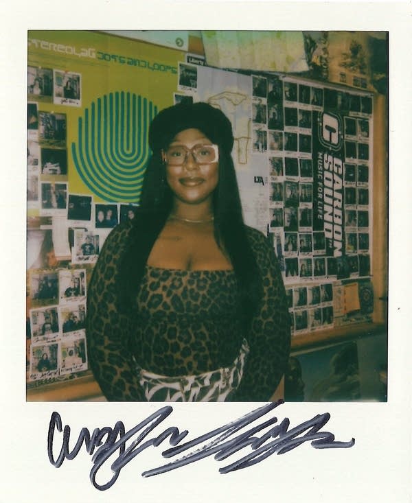 a woman posing in a polaroid photo in the carbon sound studio