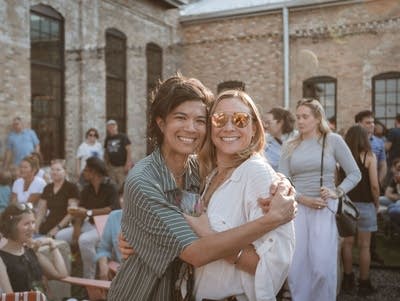 Diane poses for a photo with her wife.