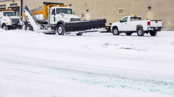 Road salt mixed with magnesium chloride lines a street.